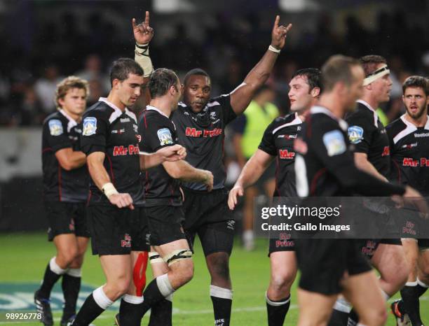 Tendai Mtawarira raises his arms in celebration amongst Sharks teammates during the Super 14 match between Sharks and Vodacom Stormers at Absa...