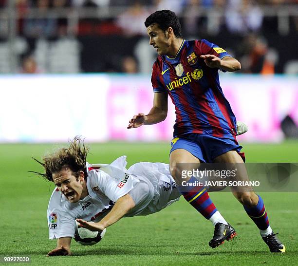 Sevilla's midfielder Diego Capel vies with Barcelona's forward Pedro Rodriguez during their Spanish league football match beetwen Sevilla and...