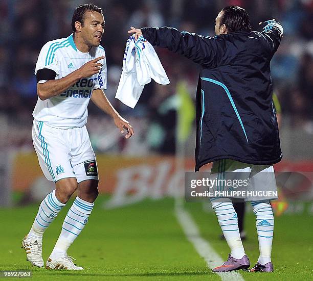 Marseille's defender Vitorino Hilton celebrates after scoring a goal during the French L1 football match Lille vs. Marseille on May 8, 2010 at Lille...