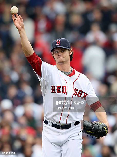 Clay Buchholz of the Boston Red Sox sends the ball to first for the out in the second inning against the New York Yankees on May 8, 2010 at Fenway...