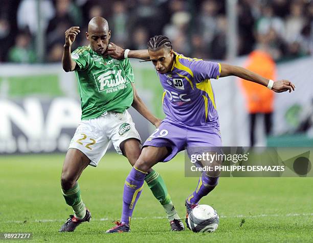 Toulouse's midfielder Etienne Capoue vies with Saint-Etienne's midfielder Gelson Fernandes during the French L1 football match Saint-Etienne vs...