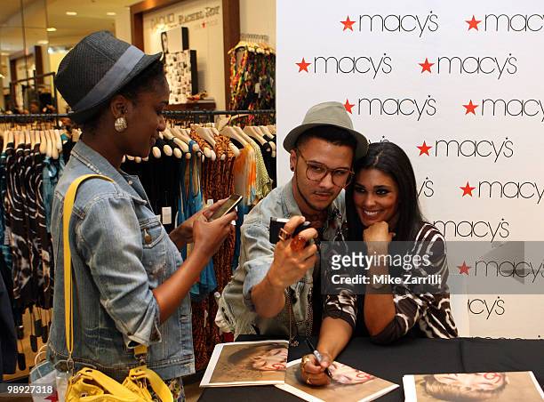Fans pose for pictures with fashion designer Rachel Roy during her meet and greet session with shoppers to unveil her Spring 2010 Rachel Rachel Roy...