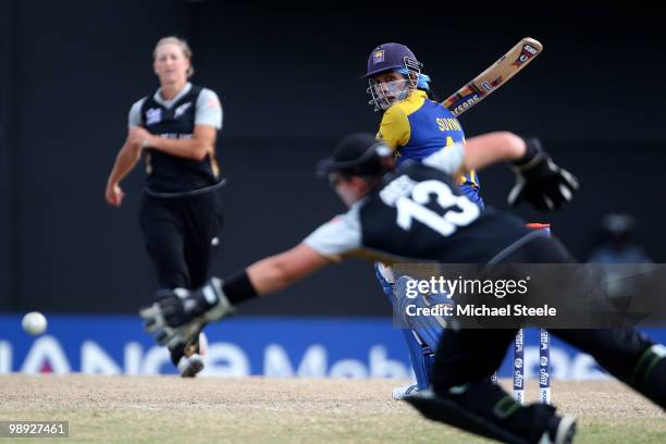 Suvini De Alwis of Sri Lanka looks back as Rachel Priest the New Zealand wicketkeeper dives in vain for a catch off the bowling of Sophie Devine...