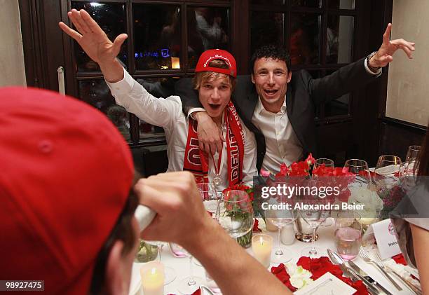 Holger Badstuber and Mark van Bommel of Bayern Muenchen celebrate their German Championship title during a dinner on May 8, 2010 in Munich, Germany.