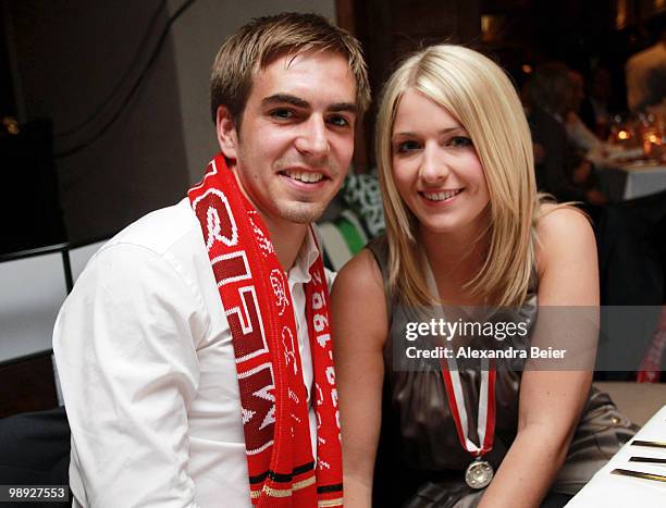 Philipp Lahm of Bayern Muenchen poses with his girlfriend Claudia Schattenberg during a dinner to celebrate their German championship title on May 8,...