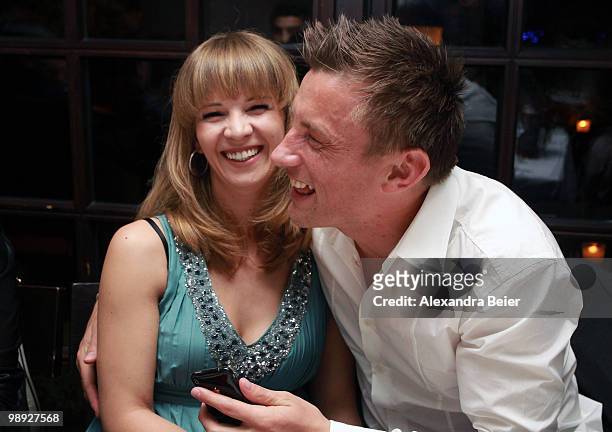 Ivica Olic of Bayern Muenchen and his wife Natalie laugh during a dinner to celebrate their German Championship title on May 8, 2010 in Munich,...