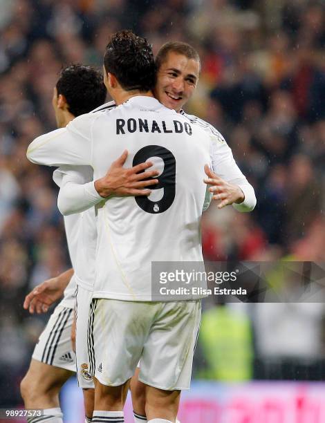 Karim Benzema of Real Madrid celebrates with Cristiano Ronaldo after scoring during the La Liga match between Real Madrid and Athletic Club at...