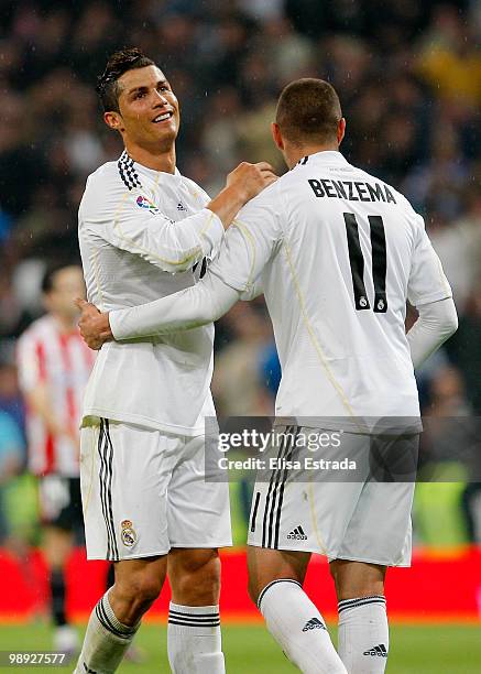 Karim Benzema of Real Madrid celebrates with Cristiano Ronaldo after scoring during the La Liga match between Real Madrid and Athletic Club at...