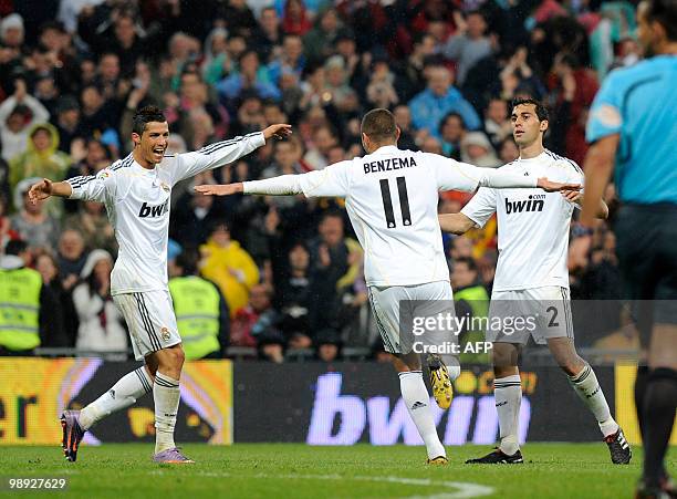 Real Madrid's forward karim Benzema celebrates with teammate Cristiamo Ronaldo L) after scorIing against Athletic Bilbao during a Spanish league...