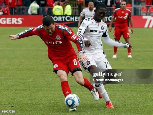 Dan Gargan of Toronto FC is bumped by Patrick Nyarko of Chicago Fire during a MLS game at BMO Field May 8, 2010 in Toronto, Ontario, Canada.