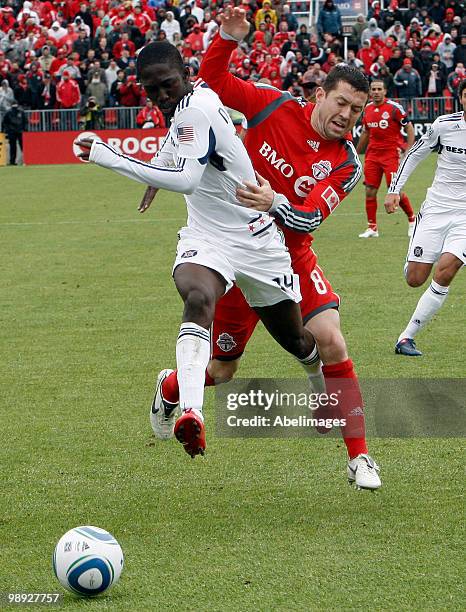 Dan Gargan of Toronto FC is bumped by Patrick Nyarko of Chicago Fire during a MLS game at BMO Field May 8, 2010 in Toronto, Ontario, Canada.