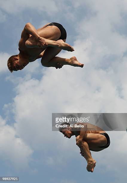 Troy Dumais and Kristian Ipsen of the USA dive during the Men's Synchronized 3 Meter Springboard Final at the Fort Lauderdale Aquatic Center during...