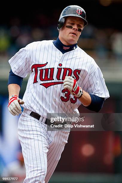 Justin Morneau of the Minnesota Twins rounds the bases after hitting a two-run home run against the Baltimore Orioles at Target Field on May 8, 2010...