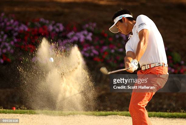 Ryuji Imada of Japan plays from a bunker on the 15th hole during the third round of THE PLAYERS Championship held at THE PLAYERS Stadium course at...