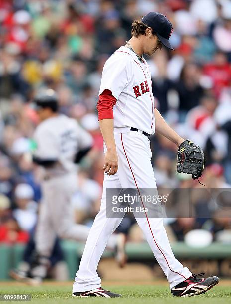 Clay Buchholz of the Boston Red Sox reacts after giving up a solo home run to Mark Teixeira of the New York Yankees on May 8, 2010 at Fenway Park in...