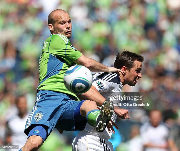 Freddie Ljungberg of the Seattle Sounders FC battles Todd Dunivant of the Los Angeles Galaxy on May 8, 2010 at Qwest Field in Seattle, Washington....
