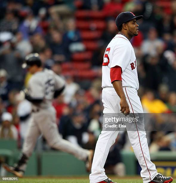 Ramon Ramirez of the Boston Red Sox reacts as Mark Teixeira of the New York Yankees rounds third after a solo home run in the seventh inning on May...