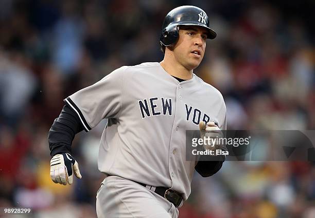 Mark Teixeira of the New York Yankees rounds the bases after he hit a solo home run in the seventh inning against the Boston Red Sox on May 8, 2010...