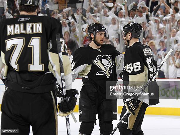 Kris Letang of the Pittsburgh Penguins celebrates his goal with Evgeni Malkin and Sergei Gonchar against the Montreal Canadiens in Game Five of the...