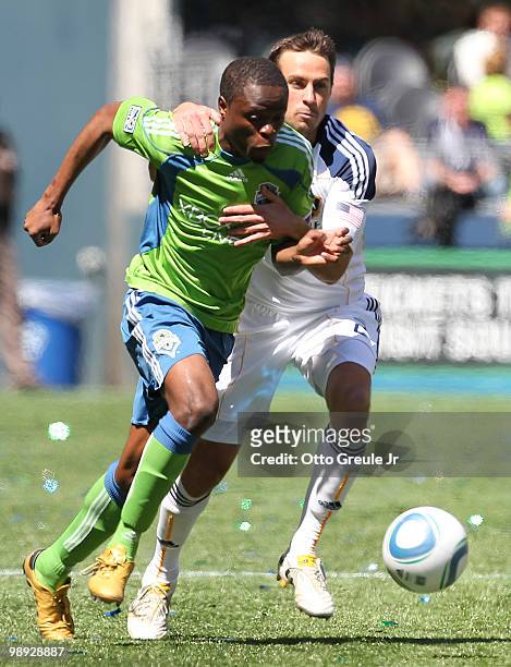 Steve Zakuani of the Seattle Sounders FC dribbles against Todd Dunivant of the Los Angeles Galaxy on May 8, 2010 at Qwest Field in Seattle,...