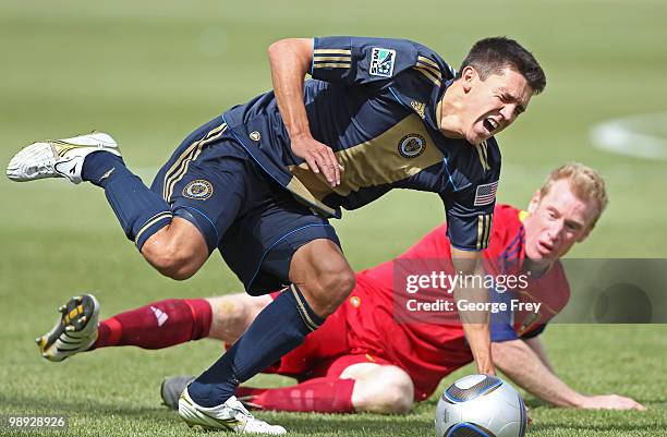 Nat Borchers of Real Salt Lake trips Shea Salinas of Philadelphia Union during the second half of an MLS soccer game in Rio Tinto Stadium May 8, 2010...