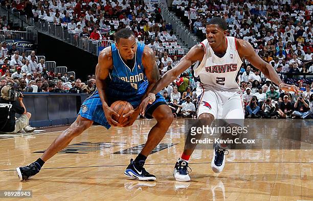 Joe Johnson of the Atlanta Hawks defends against Rashard Lewis of the Orlando Magic during Game Three of the Eastern Conference Semifinals during the...
