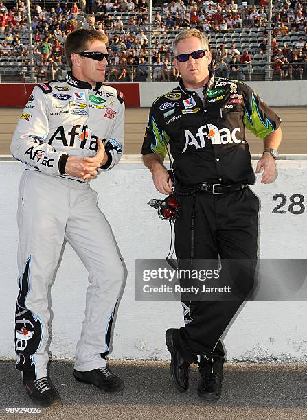 Carl Edwards, driver of the Aflac Ford, stands on the grid with his crew chief Bob Osborne prior to the start of the NASCAR Sprint Cup series...