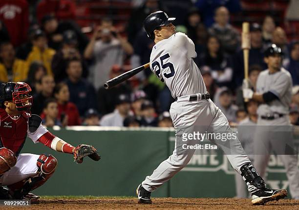 Mark Teixeira of the New York Yankees hit a two run homer in the ninth inning as Victor Martinez of the Boston Red Sox defends on May 8, 2010 at...