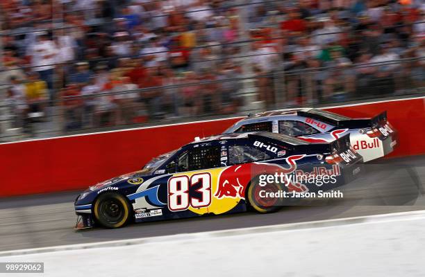 Brian Vickers, driver of the Red Bull Toyota passes his teammate Scott Speed, driver of the Red BUll Toyota on lap 35 during the NASCAR Sprint Cup...