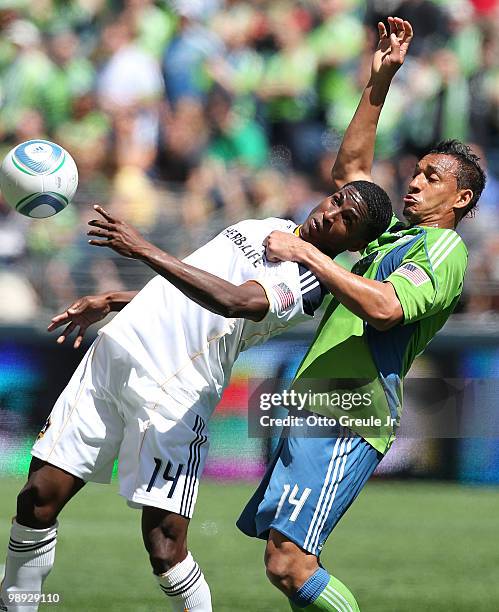 Edson Buddle of the Los Angeles Galaxy battles Tyrone Marshall of the Seattle Sounders FC on May 8, 2010 at Qwest Field in Seattle, Washington. The...