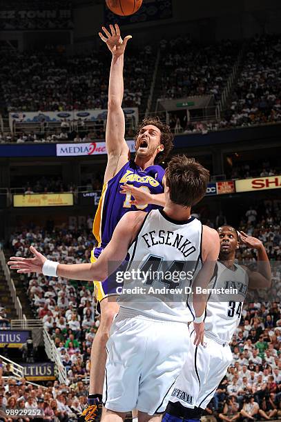 Pau Gasol of the Los Angeles Lakers goes hard to the hoop against C.J Miles and Kyrylo Fesenko the Utah Jazz in Game Three of the Western Conference...