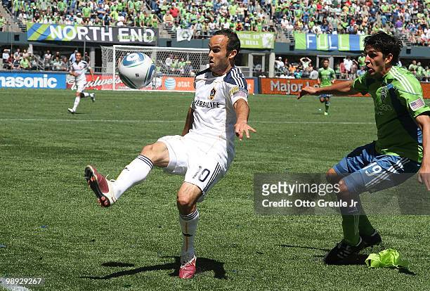 Landon Donovan of the Los Angeles Galaxy kicks the ball against Leonardo Gonzalez of the Seattle Sounders FC on May 8, 2010 at Qwest Field in...