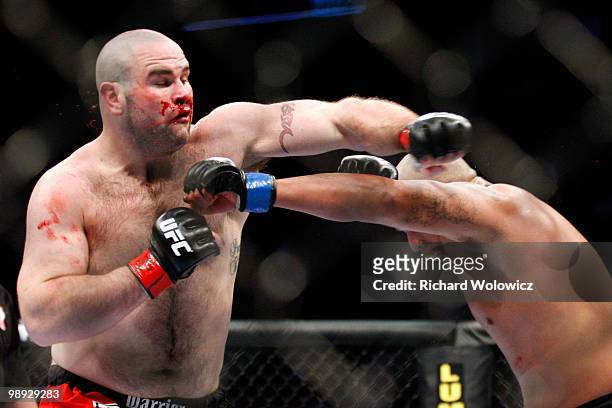 Joey Beltran punches Tim Hague in their heavyweight bout at UFC 113 at Bell Centre on May 8, 2010 in Montreal, Quebec, Canada.