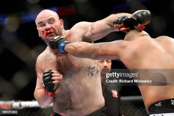 Joey Beltran punches Tim Hague in their heavyweight bout at UFC 113 at Bell Centre on May 8, 2010 in Montreal, Quebec, Canada.