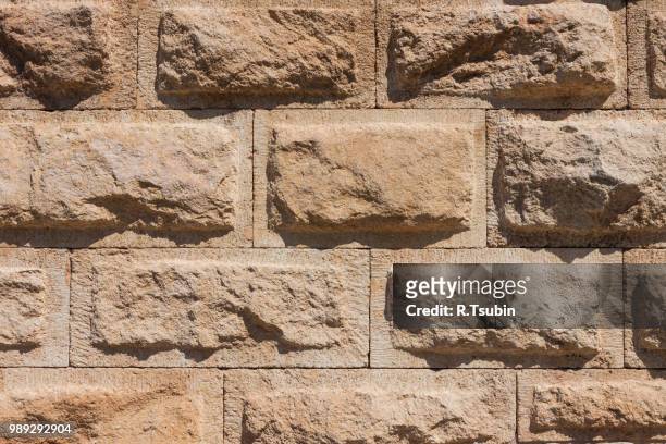 stone ancient wall texture background tiled - sandstone wall stockfoto's en -beelden