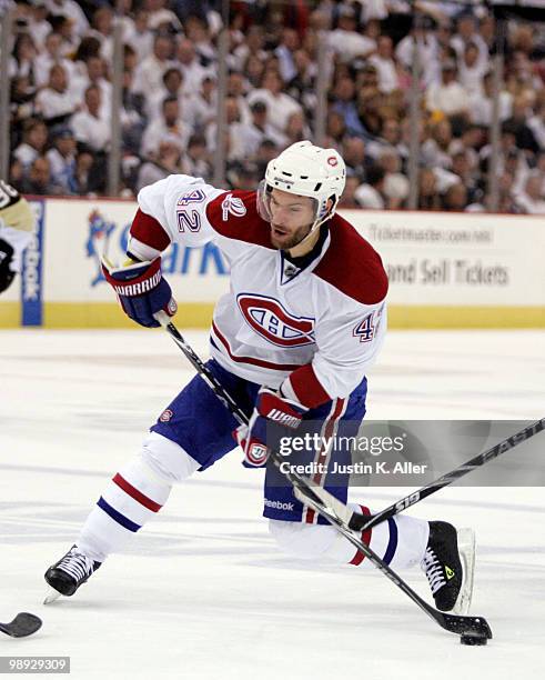 Dominic Moore of the Montreal Canadiens takes a shot on goal against the Pittsburgh Penguins in Game Five of the Eastern Conference Semifinals during...