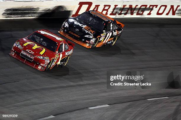 Jamie McMurray, driver of the McDonald's Chevrolet leads Denny Hamlin, driver of the FedEx Express Toyota, during the NASCAR Sprint Cup series...