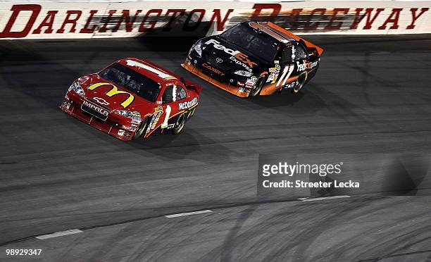 Jamie McMurray, driver of the McDonald's Chevrolet leads Denny Hamlin, driver of the FedEx Express Toyota, during the NASCAR Sprint Cup series...