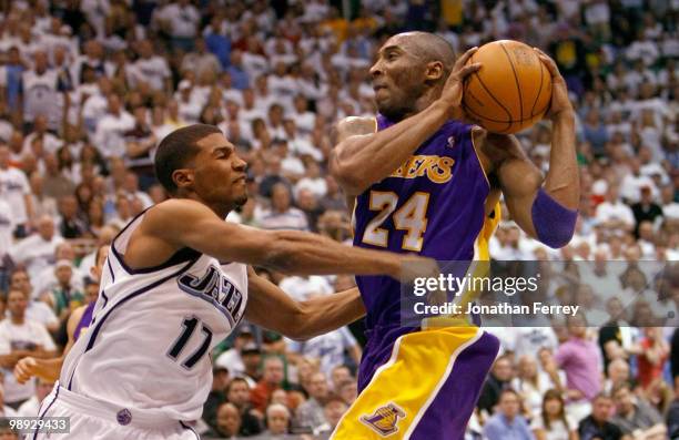 Kobe Bryant of the Los Angeles Lakers is fouled by Ronnie Price of the Utah Jazz during Game Three of the Western Conference Semifinals of the 2010...