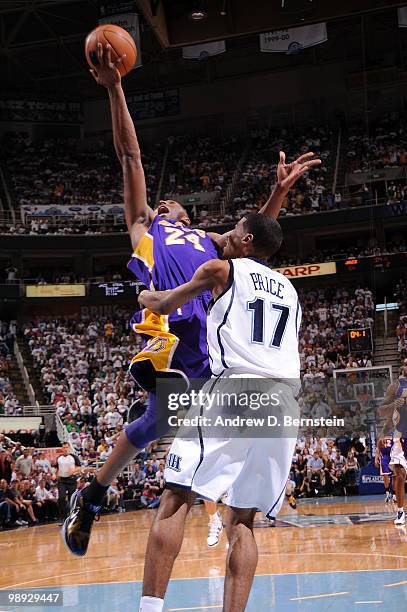 Kobe Bryant of the Los Angeles Lakers gets to the hoop against Ronnie Price of the Utah Jazz in Game Three of the Western Conference Semifinals...