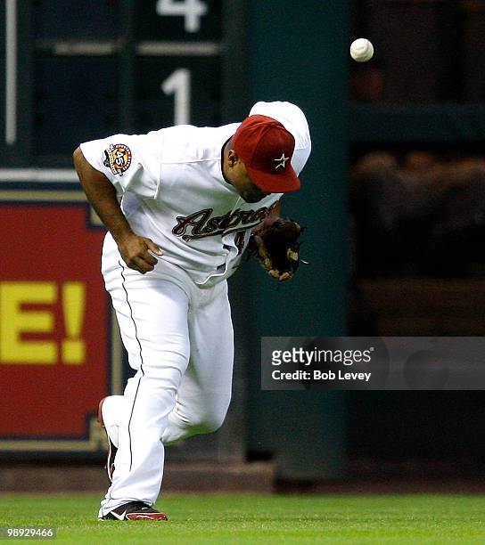 Left fielder Carlos Lee of the Houston Astros misplays a ball off his glove against the San Diego Padres at Minute Maid Park on May 8, 2010 in...