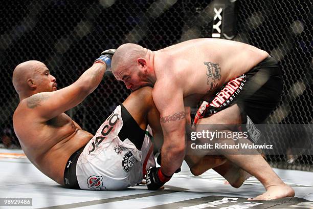 Tim Hague bites the knee of Joey Beltran in their heavyweight bout at UFC 113 at Bell Centre on May 8, 2010 in Montreal, Quebec, Canada.