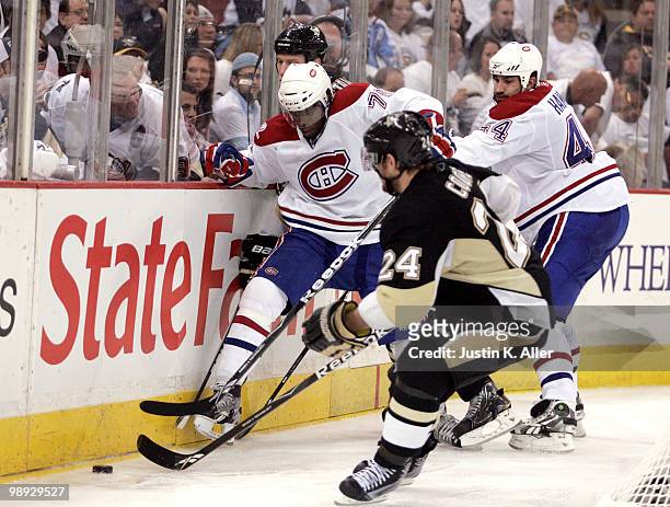 Subban of the Montreal Canadiens battles for a loose puck in front of Matt Cooke of the Pittsburgh Penguins in Game Five of the Eastern Conference...
