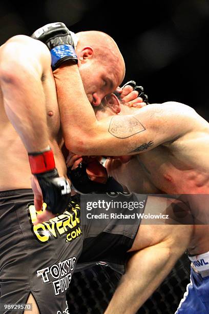 Joe Doerksen knees Tom Lawlor in their middleweight bout at UFC 113 at Bell Centre on May 8, 2010 in Montreal, Quebec, Canada.