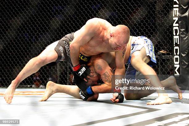 Joe Doerksen holds on to Tom Lawlor in their middleweight bout at UFC 113 at Bell Centre on May 8, 2010 in Montreal, Quebec, Canada.