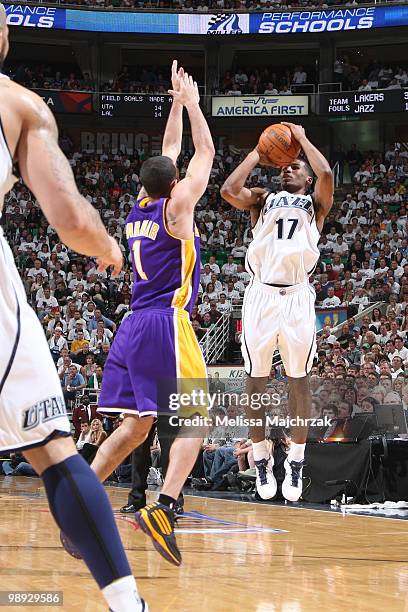 Ronnie Price of the Utah Jazz shoots the ball over Jordan Farmar of the Los Angeles Lakers in Game Three of the Western Conference Semifinals during...