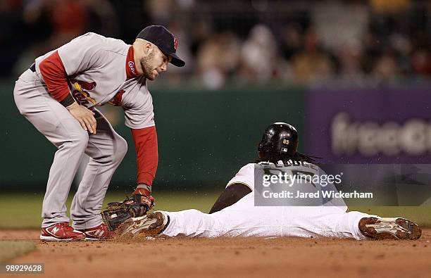 Lastings Milledge of the Pittsburgh Pirates slides safely into second past Skip Schumaker of the St Louis Cardinals during the game on May 8, 2010 at...