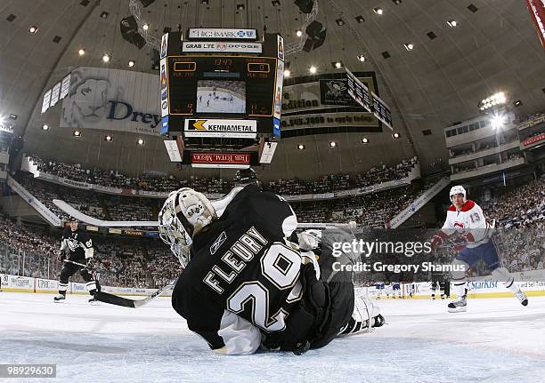 Marc-Andre Fleury of the Pittsburgh Penguins makes a save in front of Michael Cammalleri of the Montreal Canadiens in Game Five of the Eastern...