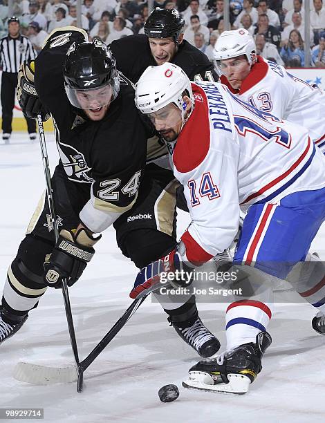 Matt Cooke of the Pittsburgh Penguins battles for the puck against Tomas Plekanec of the Montreal Canadiens in Game Five of the Eastern Conference...