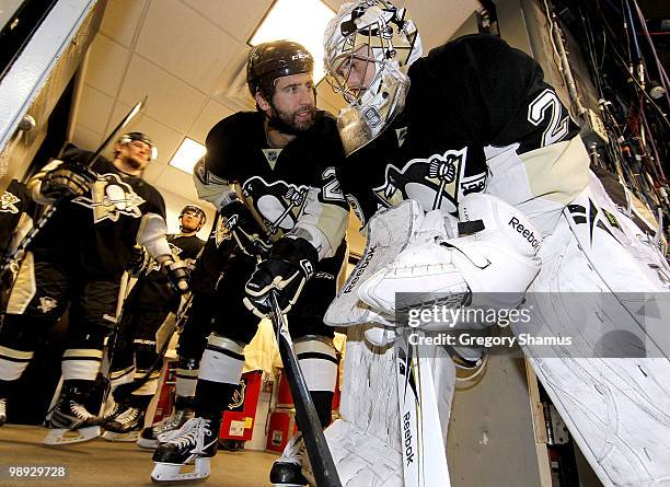 Marc-Andre Fleury of the Pittsburgh Penguins talks with Maxime Talbot before taking the ice against the Montreal Canadiens in Game Five of the...